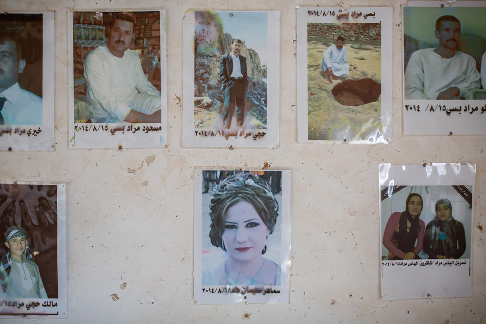 Photos of family members killed by ISIS hang on the wall in the Murad family home in Kocho, northern Iraq.
