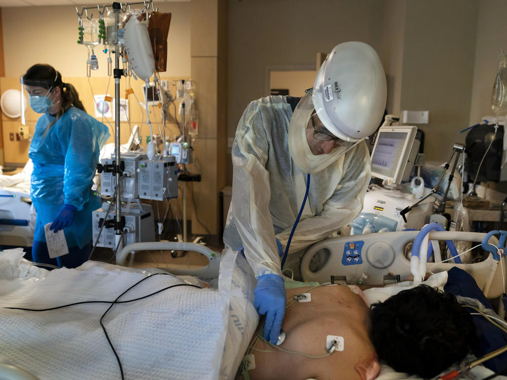 A patient is treated for COVID-19 at Providence Holy Cross Medical Center in Los Angeles. Hospitalizations because of the coronavirus are surging in California.