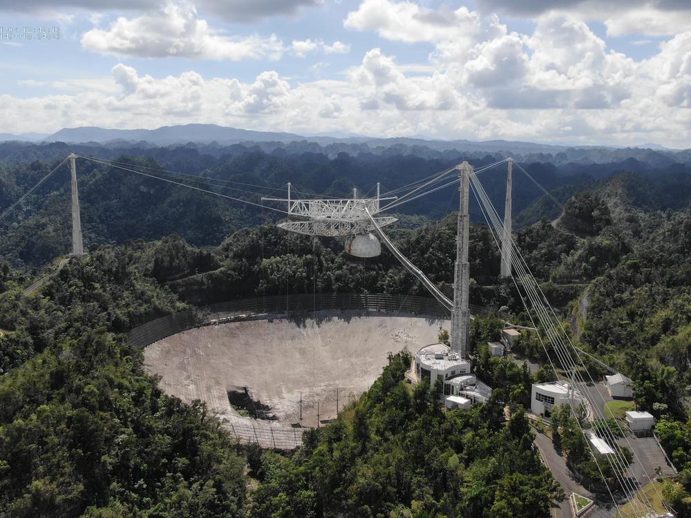 The Arecibo Observatory's mammoth telescope collapsed overnight. It's seen here in November, after a cable damaged its dish.