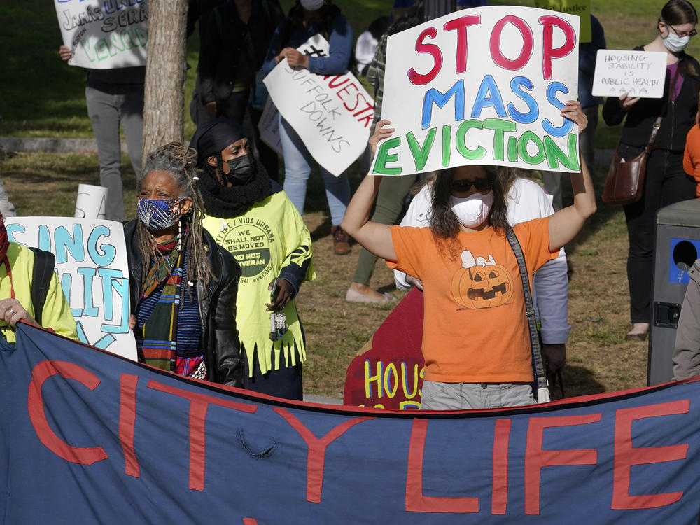 Protesters call for support for tenants and homeowners at risk of eviction during a demonstration on Oct. 11 in Boston. A federal moratorium on evictions is set to expire at the end of December.