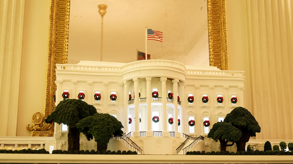 A gingerbread White House stands in the State Dining Room during the 2020 Christmas preview at the White House, Monday, Nov. 30, 2020, in Washington. (AP Photo/Patrick Semansky)