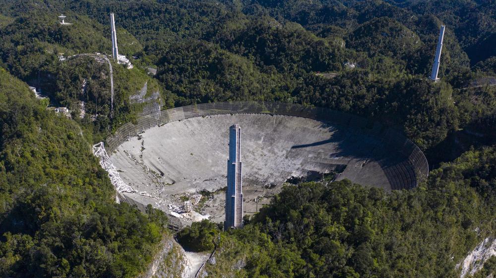The Arecibo Observatory collapsed when its 900-ton receiver platform fell hundreds of feet, smashing through the radio dish below.