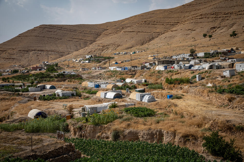 Shelters meant to be emergency tents house displaced Yazidis on the side of Sinjar mountain in 2019.