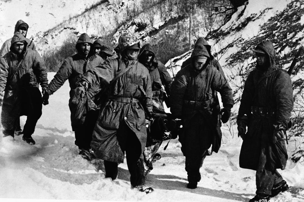 Frostbite casualties of 1st Marine Division and 7th Infantry Division, who linked to break out of Communist encirclement, wait for evacuation by plane in the Chosin area, North Korea in December 1950.