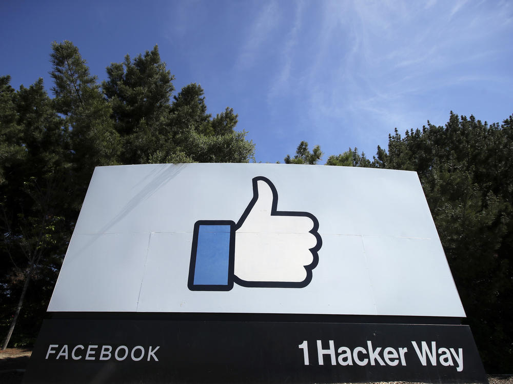 The thumbs-up Like logo on a sign at Facebook headquarters in Menlo Park, Calif. The Justice Dept. is suing the company for allegedly discriminating against U.S. workers in favor of temporary visa holders.