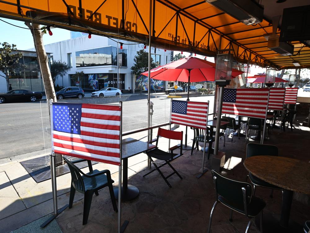 Patio tables are empty at a diner this week in West Hollywood, Calif., after Los Angeles County banned outdoor dining amid the pandemic. The struggles of restaurants and retailers are expected to have led to sharply slower job growth last month.