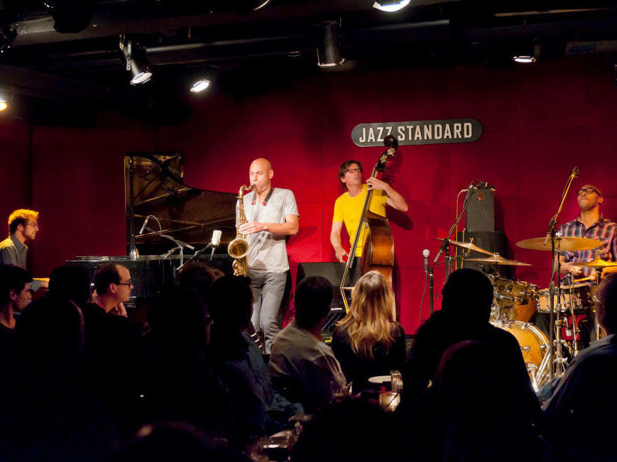 The quartet James Farm (pianist Aaron Parks, saxophonist Joshua Redman, bassist Matt Penman and drummer Eric Harland), playing at New York City's Jazz Standard in 2011.