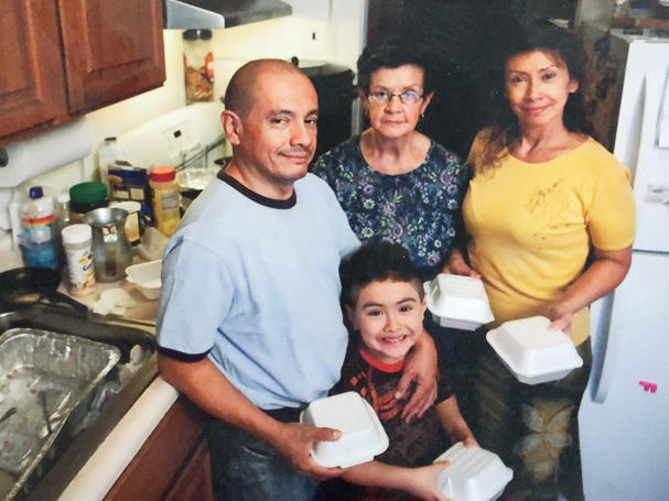 The Muñoz family (from left: Jorge, Justin, Blanca and Luz) prepares meals from their kitchen in 2010.