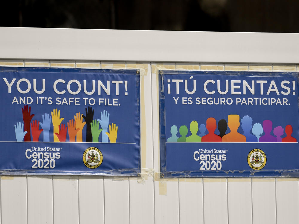 Signs promoting the 2020 census hang on a fence in Reading, Pa., in September. The Census Bureau has found irregularities in this year's census responses that could affect the counting of millions of people.
