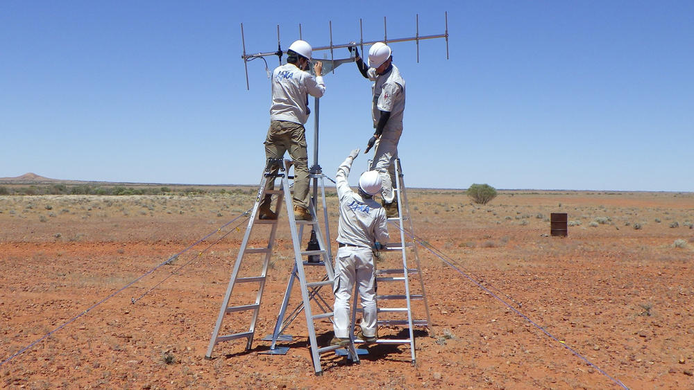 JAXA crew members set up antennas last month in Woomera, South Australia. The setup is meant to help researchers locate a proverbial needle in a haystack after the sample lands.