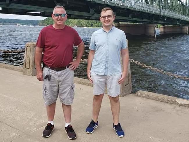 Tyler Skluzacek (right) helped develop a smartwatch app to help disrupt his father Patrick's nightmares. The app recently won approval from the Food and Drug Administration.