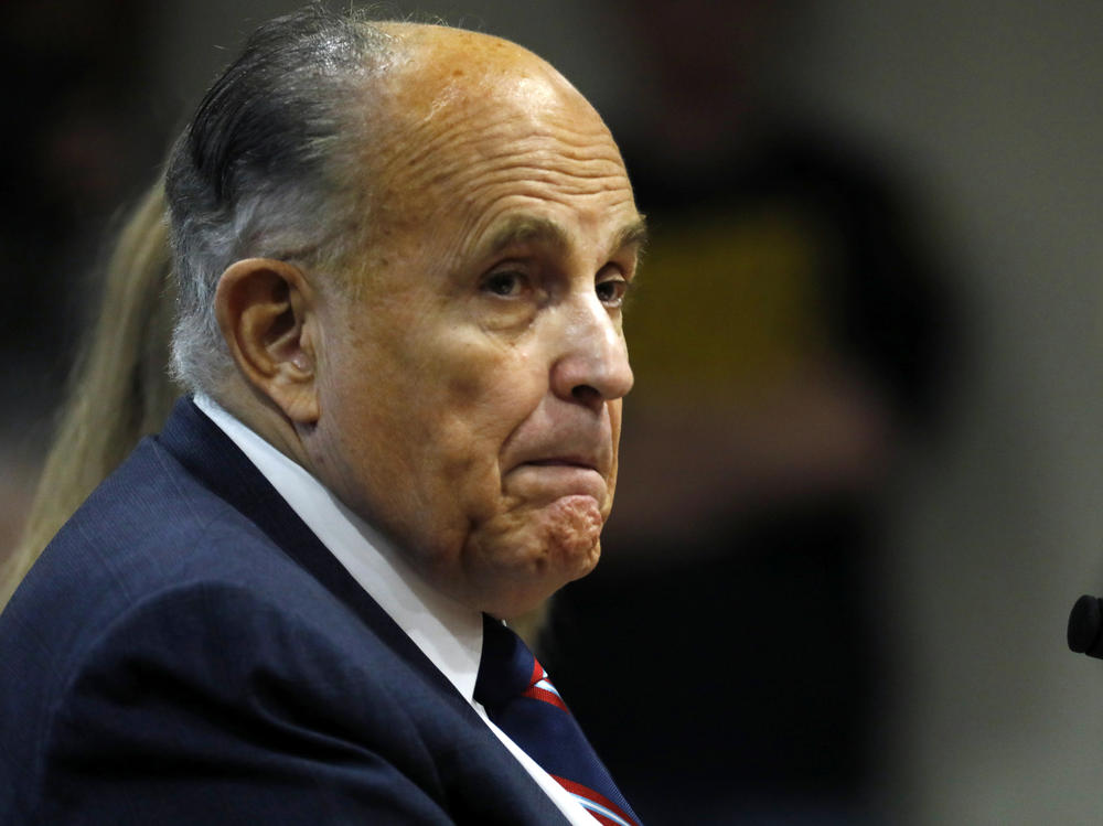 Rudy Giuliani, personal lawyer of President Trump, looks on during an appearance before Michigan's House Oversight Committee in Lansing, Mich., on Dec. 2.