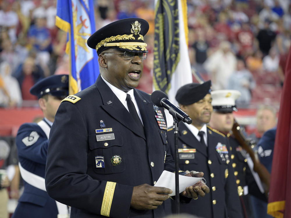 Gen. Lloyd Austin addresses military recruits during an induction ceremony in Tampa, Fla., in 2015.