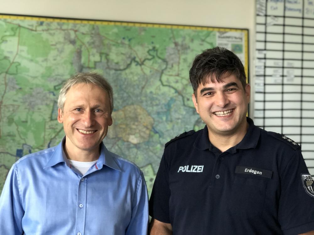 Officers Eckhardt Lazai (left) and Ersin Erdogan help teach behavioral content to cadets at the Berlin Police Academy. The two invite recently arrived refugees from Syria, Iraq and Afghanistan to help train their cadets.