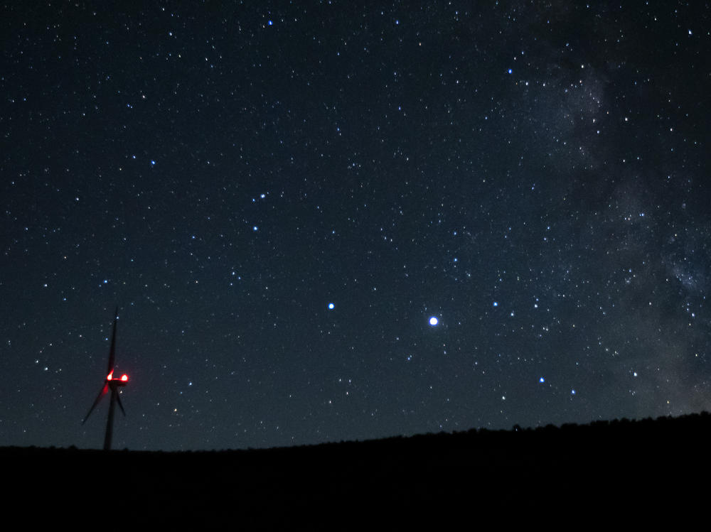 Saturn (center, left) and Jupiter (center, right) share a night sky earlier this year near Vantage, Wash. Already this past summer, the two planets were growing closer in the night sky.