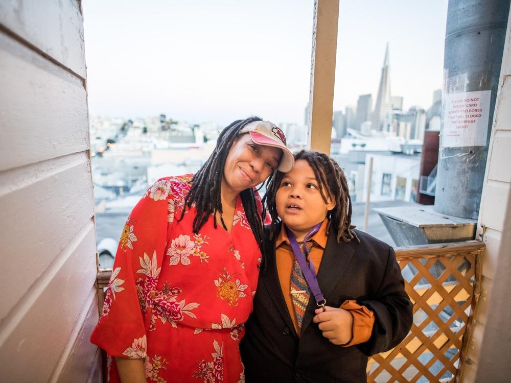 Jessica Ellis and her son, King, pose for a portrait on the back stairs of their apartment building on Nov. 15.