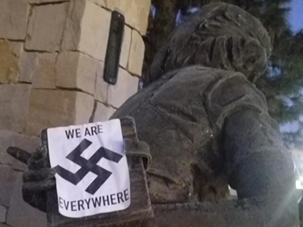 A swastika sticker on a statue at the Idaho Anne Frank Human Rights Memorial in Boise. The vandalism took place sometime between Monday evening and Tuesday morning, Boise police said.