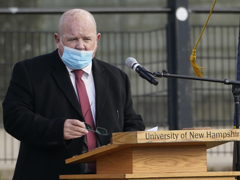 New Hampshire House Speaker Dick Hinch speaks on Dec. 2 during an outdoor legislative session at the University of New Hampshire in Durham, N.H. Hinch died of COVID-19 on Dec. 9, just a week after he was sworn in as leader of the state's newly Republican-led House. He was 71.