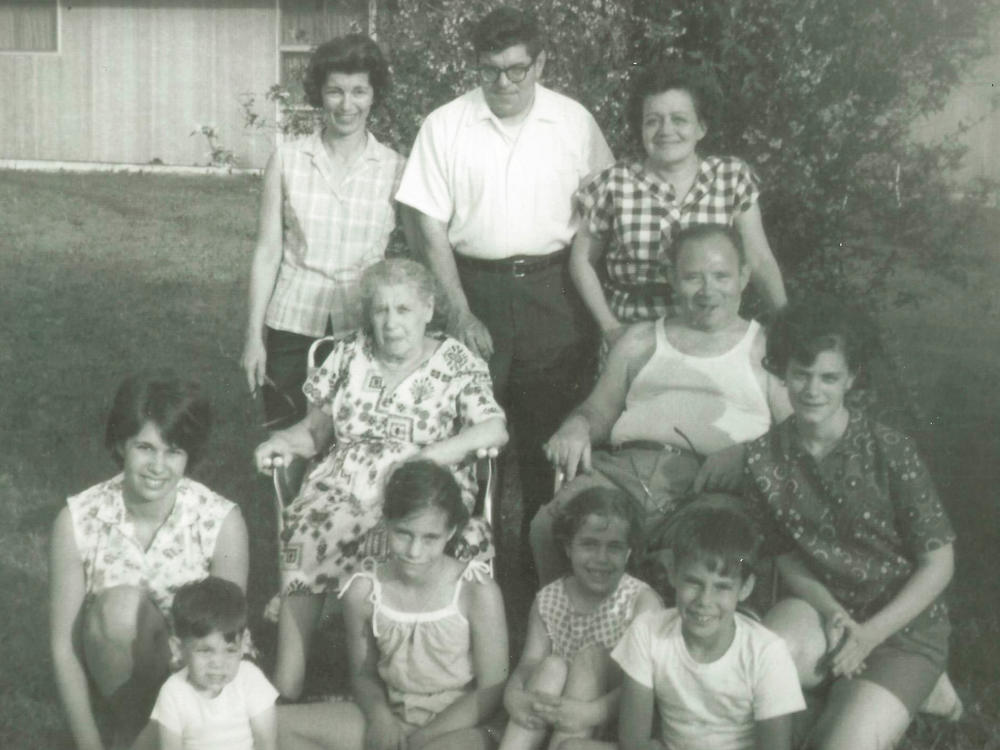 Howard Berkes (seated, front row right) volunteered to be part of a COVID-19 research study this year. He says his family, photographed here in the 1960s, had a history of stepping up during difficult times. That includes his grandparents (in middle), who fled the pogroms of Eastern Europe in the 1920s to raise a family in the United States.