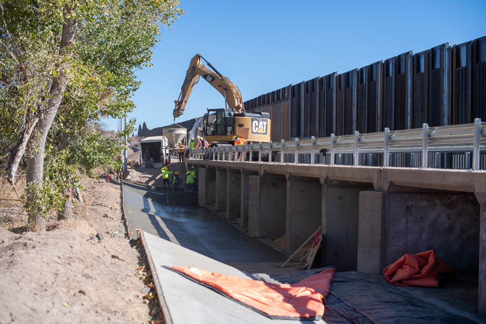 Contractors are building concrete culverts across creekbeds on the border.  Property owners warn the steel bollard wall across the creeks will catch debris and worsen flooding.