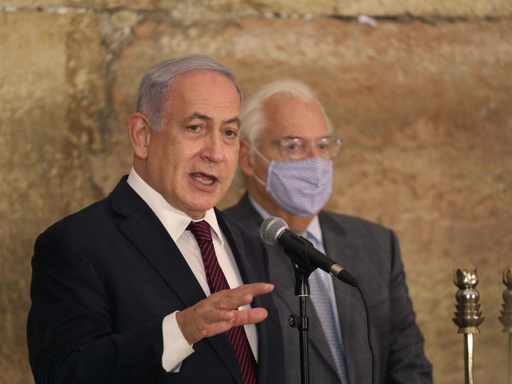 Israeli Prime Minister Benjamin Netanyahu, seen Thursday with U.S. Ambassador to Israel David Friedman at the Western Wall in Jerusalem's Old City, thanked Morocco's King Mohammed VI 