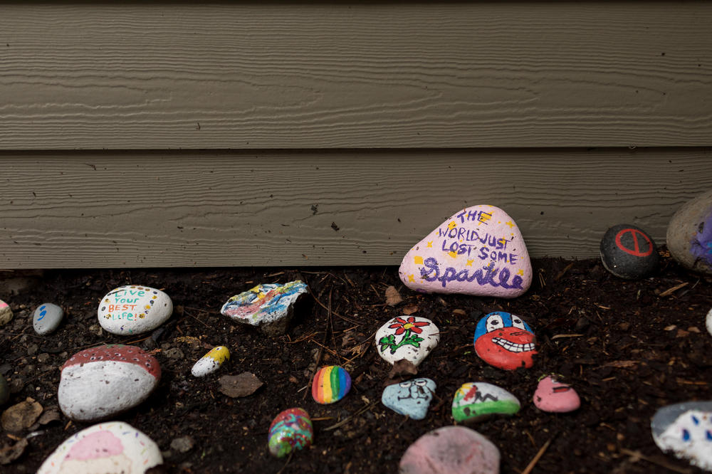 Painted rocks sit outside Sarah McSweeney's group home in Oregon City, Ore., on Nov. 24, 2020. McSweeney's housemates painted a rock to read 