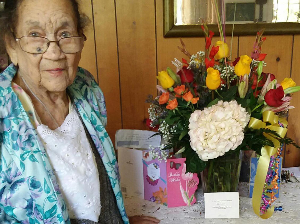 Ella Augusta Johnson Dinkins, posing on her 102nd birthday, at her home in Eatonville, Fla.