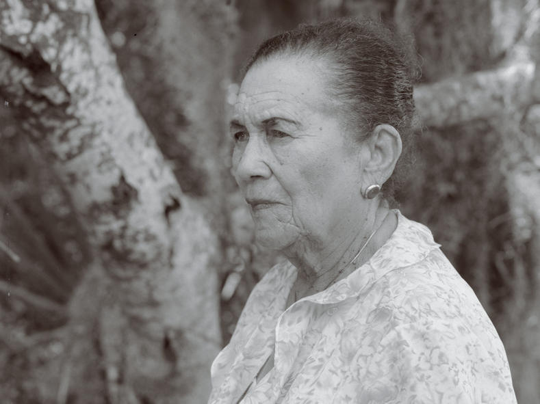 Ella Augusta Johnson Dinkins, posing in a garden, one of her favorite places.