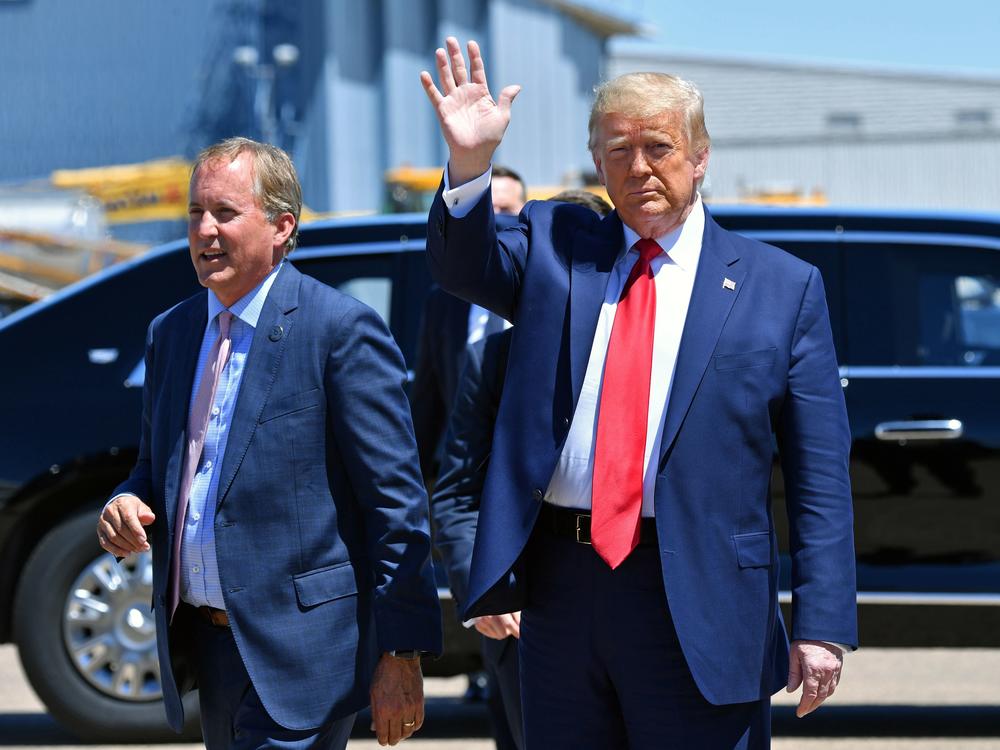 Texas Attorney General Ken Paxton, seen here with President Trump in June in Dallas, sued four states that Joe Biden carried in the general election, claiming their changes to election procedures during the pandemic violated federal law.