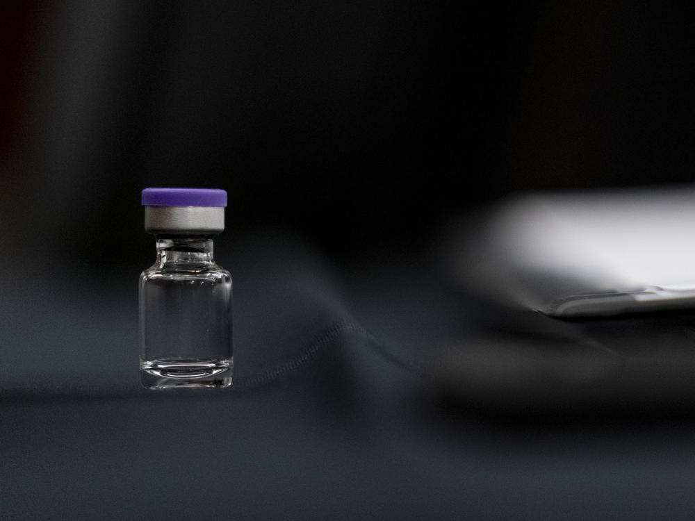 An example of a vial that will carry the COVID-19 vaccine produced by Pfizer and BioNTech sits on display during a Senate subcommittee hearing Thursday.
