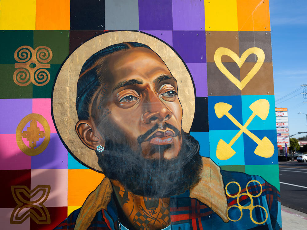 Nipsey Hussle is part of a mural featuring other local notable people on the wall of a bank in the rapper's Hyde Park neighborhood. In the wake of Hussle's March 2019 death, many murals of the beloved Los Angeles musician were painted in the Hyde Park neighborhood near his Marathon Clothing store.
