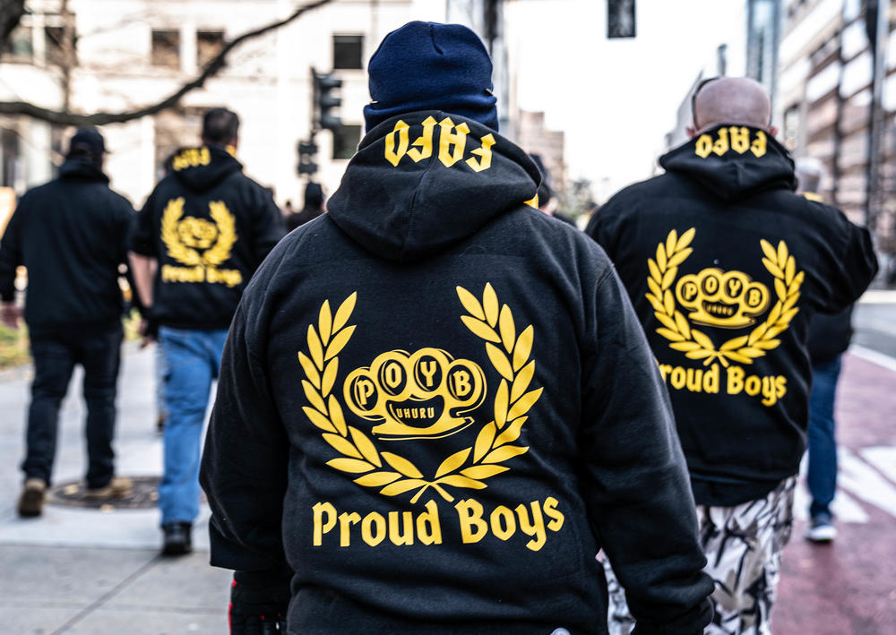 Proud Boys walk away from Black Lives Matter Plaza after police officers turned them away from counterprotesters.