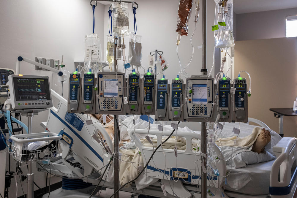 IV pumps and electrocardiogram machines are seen in a patient's room last week in the COVID-19 intensive care unit at United Memorial Medical Center in Houston.