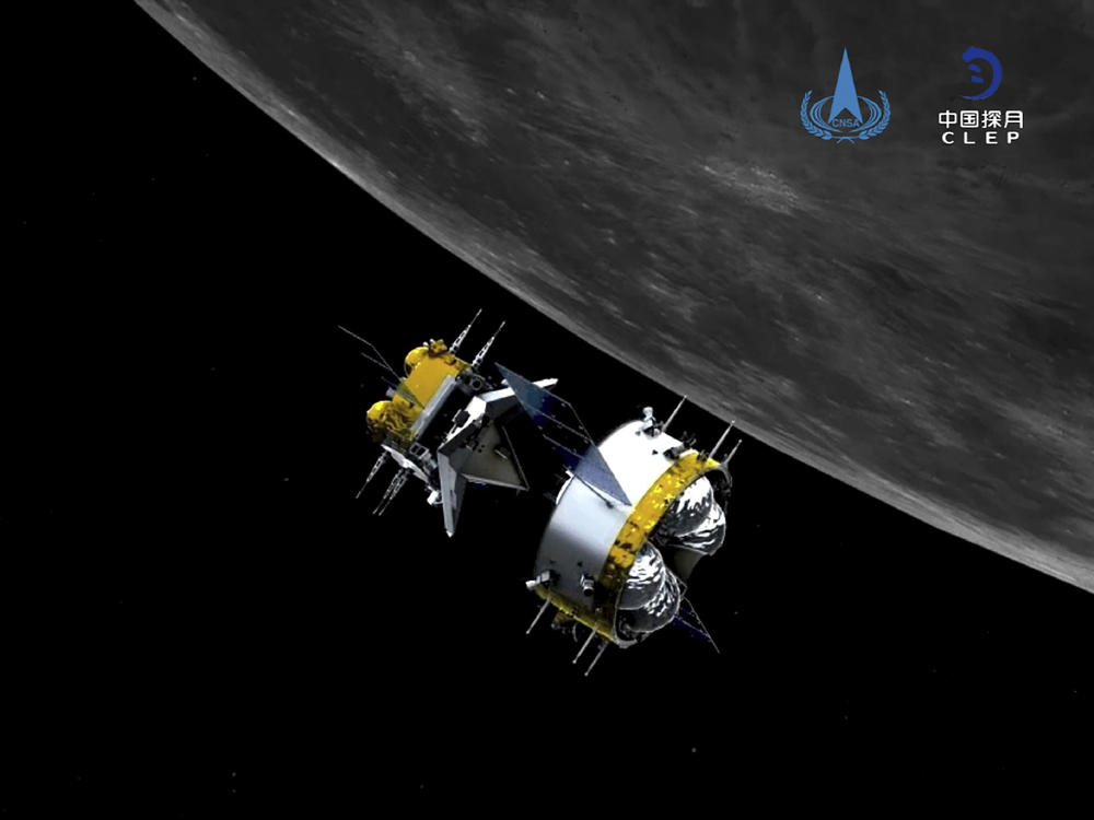 This graphic simulation image provided by China National Space Administration shows the orbiter and returner combination of China's Chang'e-5 probe after its separation from the ascender. The probe is on its way back to Earth, bearing gifts.