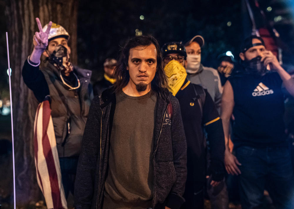 Trump supporters stand with the Proud Boys near Lafayette Square.
