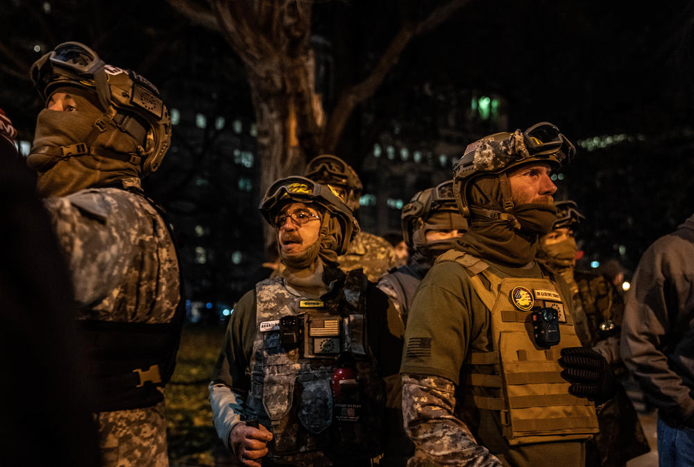 Members of the Proud Boys stand in front of Lafayette Square.
