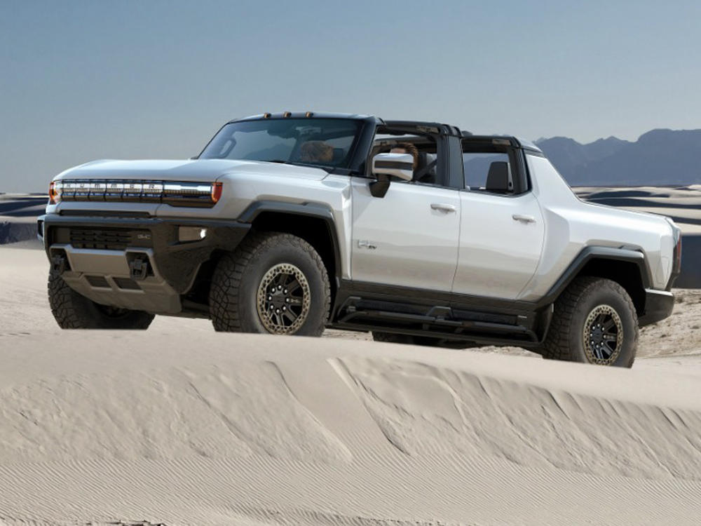 Automakers are racing to be the first to bring an electric pickup to market — including, clockwise from top left, Rivian's sporty offering, Tesla's futuristic Cybertruck, General Motors' Hummer EV and Lordstown's work-focused Endurance.