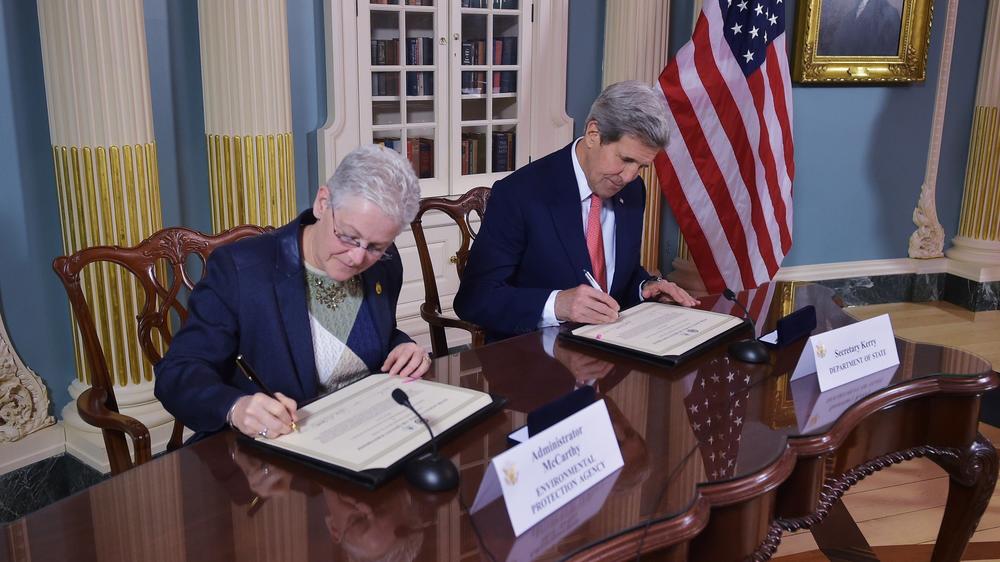 McCarthy and Kerry sign the Agreement to Enhance Post Air Quality Monitoring and Action Overseas, on Feb. 18, 2015.