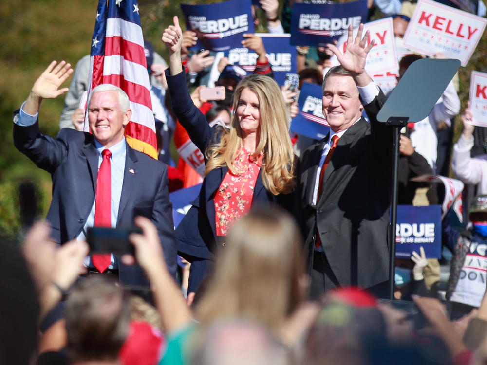 Vice President Pence waves to supporters during a Nov. 20 rally in Canton, Ga. Pence appeared alongside U.S. Sens. Kelly Loeffler and David Perdue. The Republican incumbents are defending their seats in a Jan. 5 runoff.