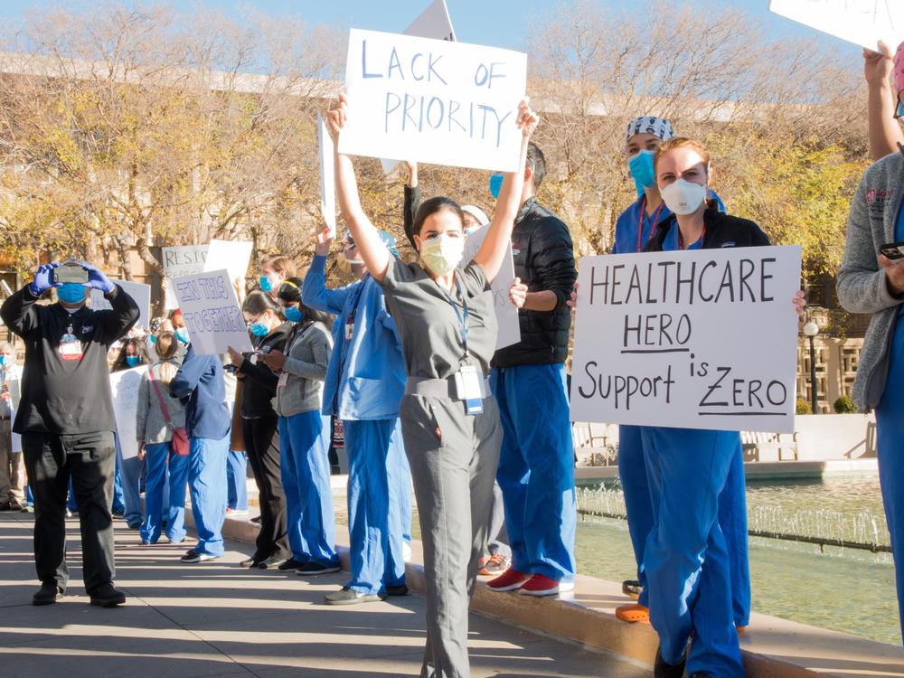 Medical residents and fellows protest the university's vaccine allocation process outside Stanford Hospital on Friday morning in Palo Alto, Calif.