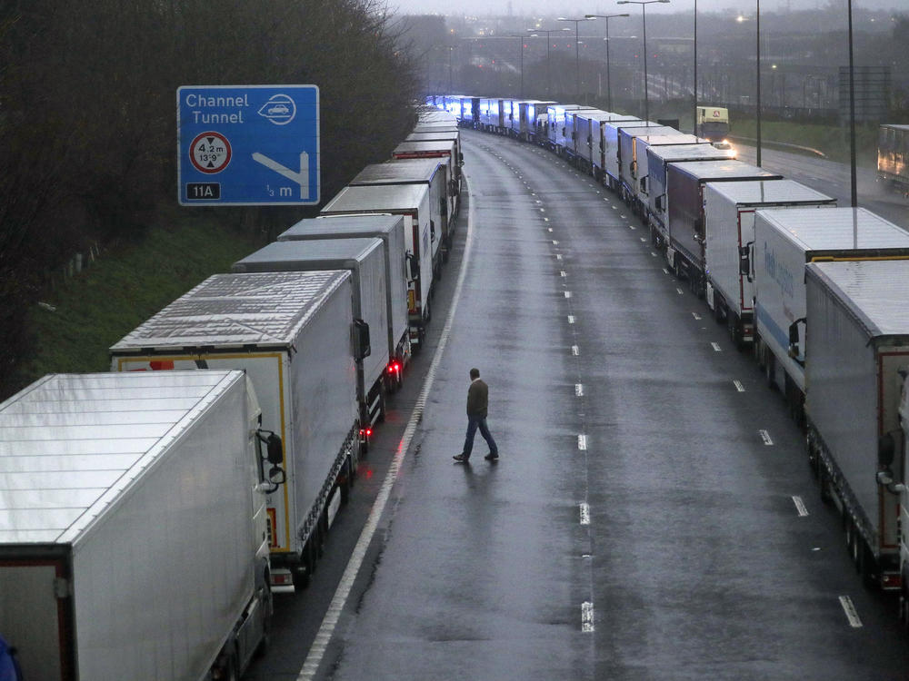 Freight trucks are parked on the M20 near Folkestone in Kent as part of Operation Stack after the Port of Dover was closed and access to the Eurotunnel terminal suspended. There are concerns over a new variant of the coronavirus, which led several nations to suspend travel and shipments from the U.K.