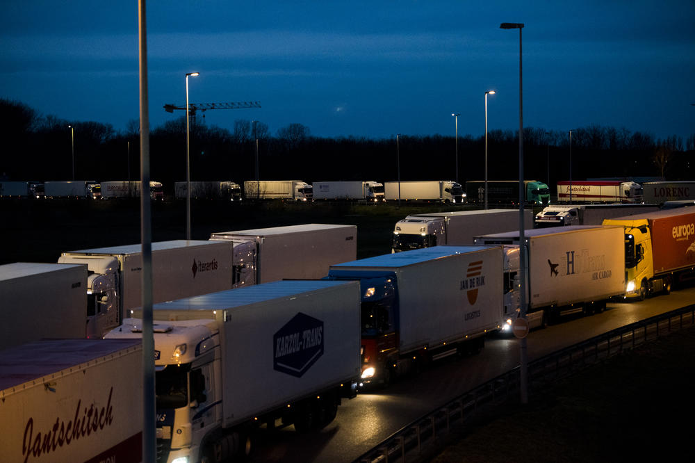 Trucks wait to enter the Eurotunnel Complex on Dec. 16, in Calais, France. Some worry long lines of trucks could preview the possible chaos and shortages resulting from a no-deal Brexit.