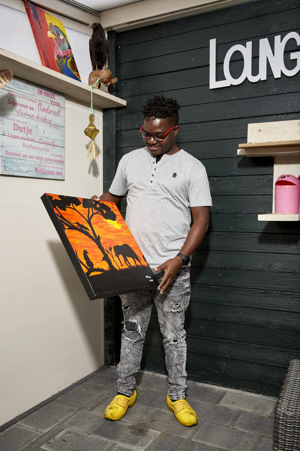 Patrick began painting as a way to pass the time in the village of Middelstum, while waiting for flights to open up.  After borrowing an easel from a family friend, Patrick spent the summer painting scenes from Malawi to remind him of home.