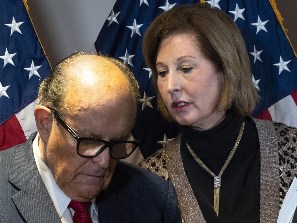 Rudy Giuliani, President Trump's personal attorney, with lawyer Sidney Powell last month in Washington. They, the Trump campaign and others face a lawsuit by an employee of Dominion Voting Systems, a vendor that has been the subject of disinformation from Trump and his allies.