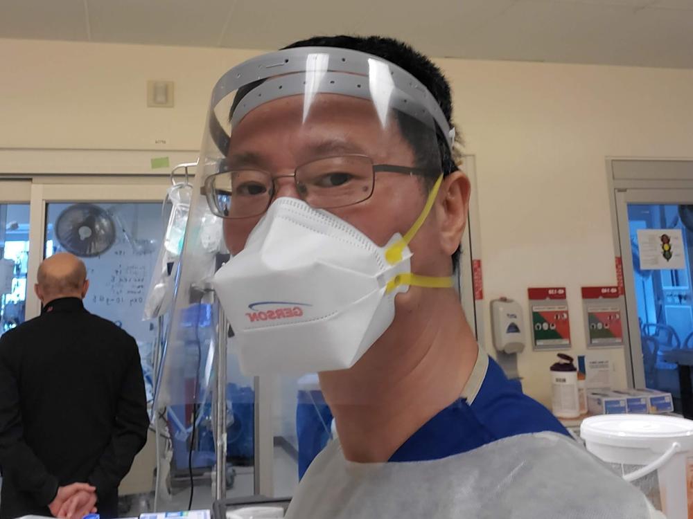 Jun Jai during a shift in the ICU at Los Angeles County+USC Medical Center. He says now the workload is the worst he's experienced since the pandemic began: 