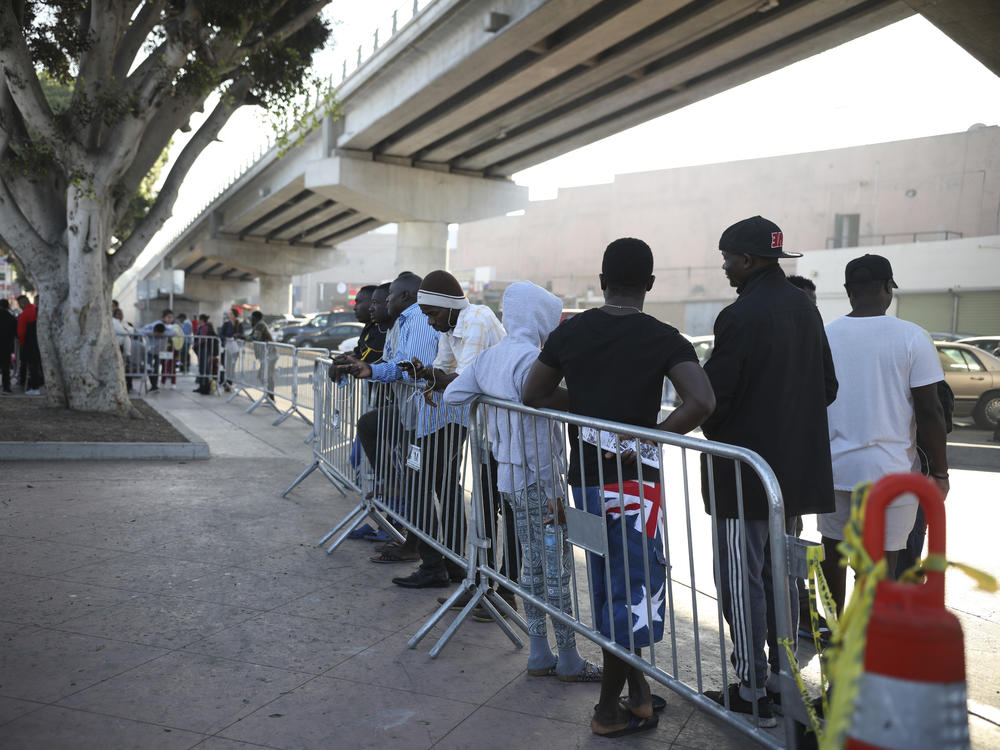 Migrants from Haiti, Africa, and Central America wait to see if their number will be called to cross the border and apply for asylum in the United States, at the El Chaparral border crossing in Tijuana, Mexico, in September 2019.