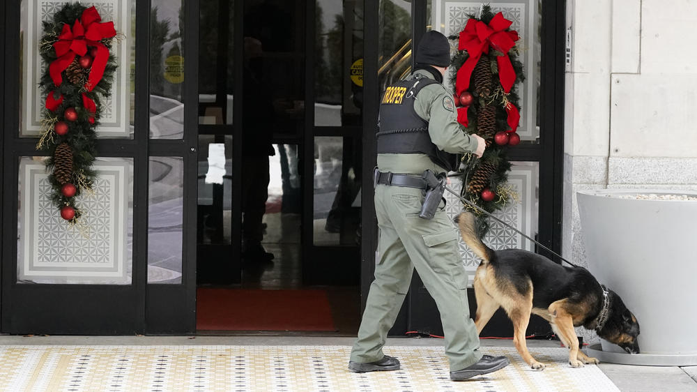 A K-9 team works in the area of an explosion in downtown Nashville, Tenn., Dec. 25. Buildings shook in the immediate area and beyond after a loud boom was heard early Christmas morning.