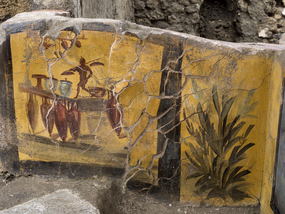 The thermopolium features several paintings like this one in the Pompeii archeological park.