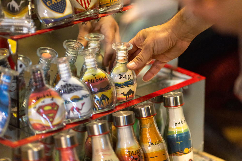 An Israeli tourist purchases souvenirs in the grand souq in Dubai in December.