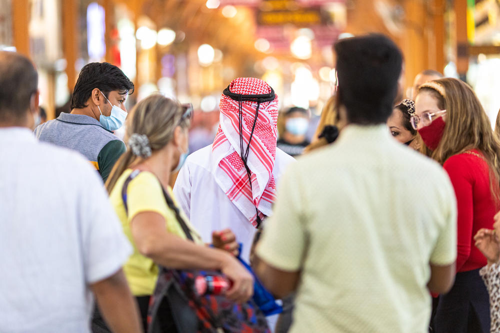 An Israeli tourist dressed in a traditional Emirati kandora walks through the gold souq in Dubai in December.